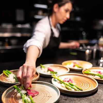 A cook slicing vegetables